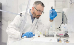 Scientist carrying out water microbiology testing in a laboratory setting