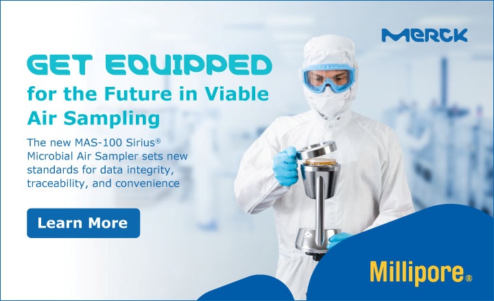 A pharmaceutical microbiologist carries out active microbial air monitoring in a cleanroom